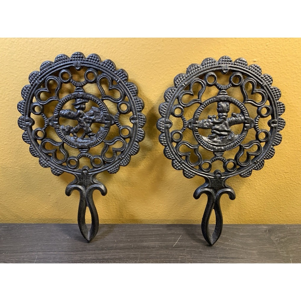 Two Fancy Vintage Cast Iron Trivets Black J.Z.H Amish Boy Girl 1952